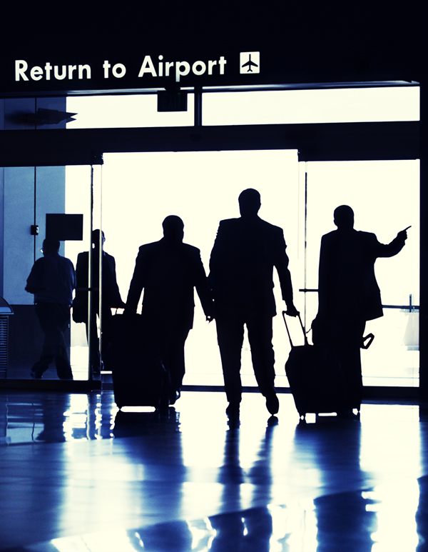 Travelers walking to the airport